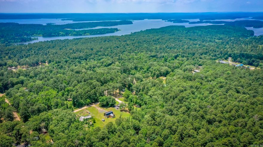 Discover your dream country retreat just one mile from DeGray Lake’s crystal waters. Nestled on a full acre, this 3-bedroom, 2.5-bath cabin (2,412 sq. ft.) offers a main-level primary suite plus two upstairs bedrooms perfect for family, guests, or vacation rentals. Recent 2024 updates—including a new roof, HVAC, and high-speed fiber-optic internet—mean you can move right in and stay connected.  Embrace outdoor adventure with boating and fishing on 13,800 acres of DeGray Lake, miles of hiking trails, and championship golf at DeGray Lake Resort & Spa. Hunters will love easy access to surrounding timberland and wildlife-rich public hunting areas.  Just minutes from Bismarck schools, Hot Springs’ historic spas, and Arkadelphia’s Henderson State University & Ouachita Baptist University, this cabin delivers the perfect blend of peaceful country living and family-friendly fun. Schedule your private tour today and start living the ultimate lake and land lifestyle!