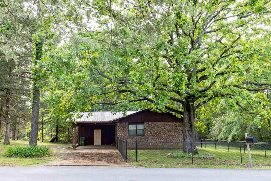 Located in the heart of Perryville, you are a short drive from shopping, schools and restaurants! This home has wonderful, mature trees - providing a rural feel in the middle of town. The HVAC is less than 2 years old! This home has a nice fenced in area in the yard, landscaping, a large storage building/shop with electrical, storage area within the carport and a metal roof! Inside, the kitchen appliances have been updated! Enjoy all the storage throughout the home and entertain your guests off the large deck, located right off the kitchen and dining area. See agent remarks.