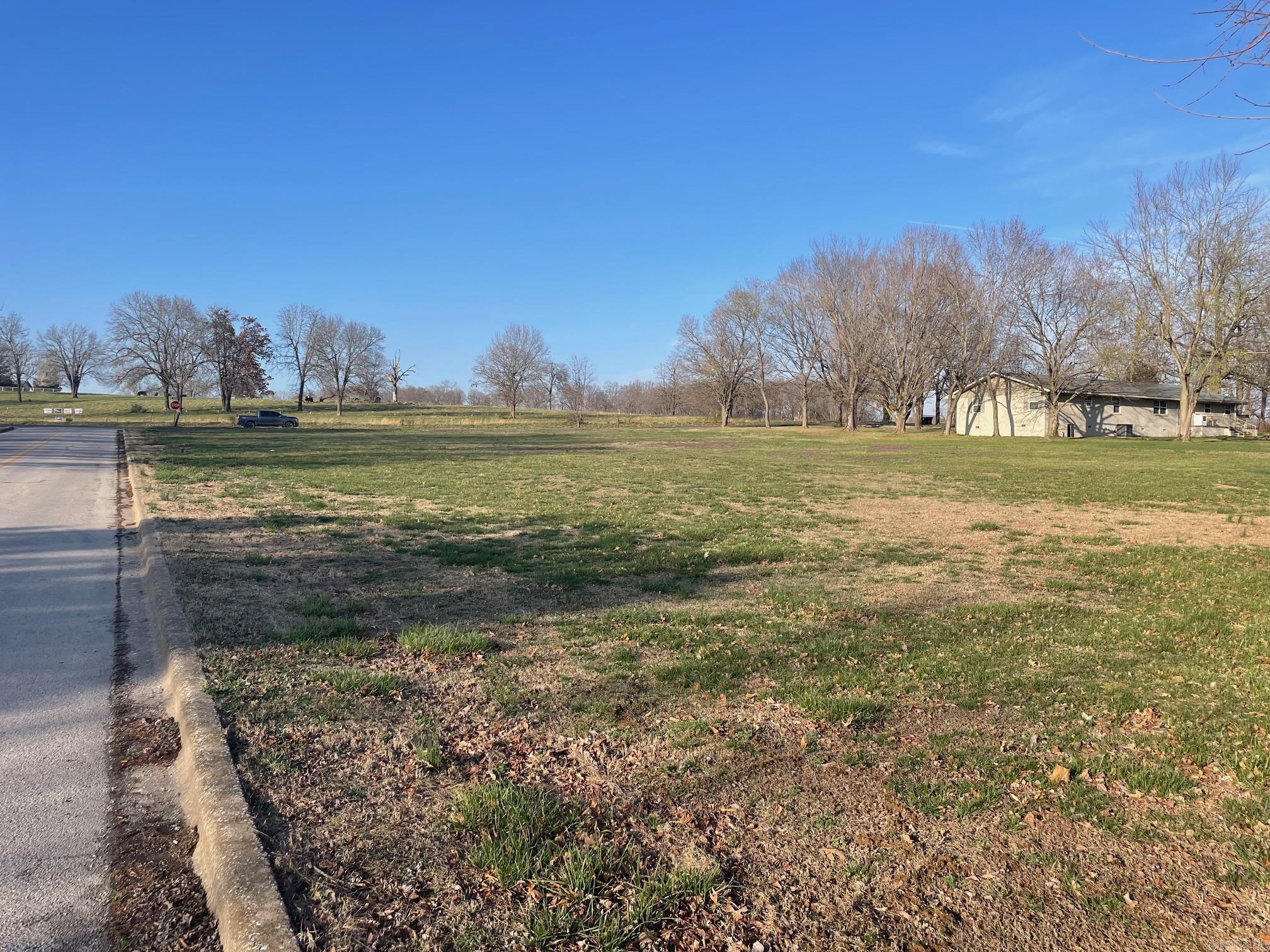 One of the last remaining easy to build on multi-family lots left in the Harrison city limits. 1.56 ac in town with city streets on two sides. Close to shopping, groceries, medical care, golf course and dining - all with a country feel. Buyer to verify availability of all utilities.