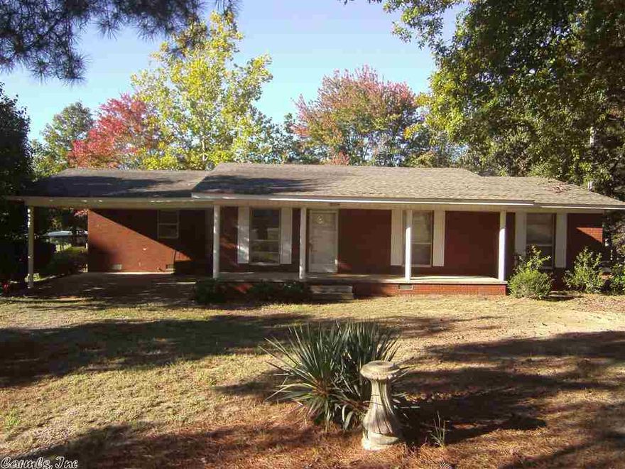 Nice 3 bedroom 2 bath brick home just outside the city limits. Has had some good of updating. New paint and some new flooring.  Very nice original hardwood floors in the bed rooms.  There could be three living areas, or two and an office.  Large yard with big mature trees.  110 ft of Hwy 16 frontage.  Come take a look today!