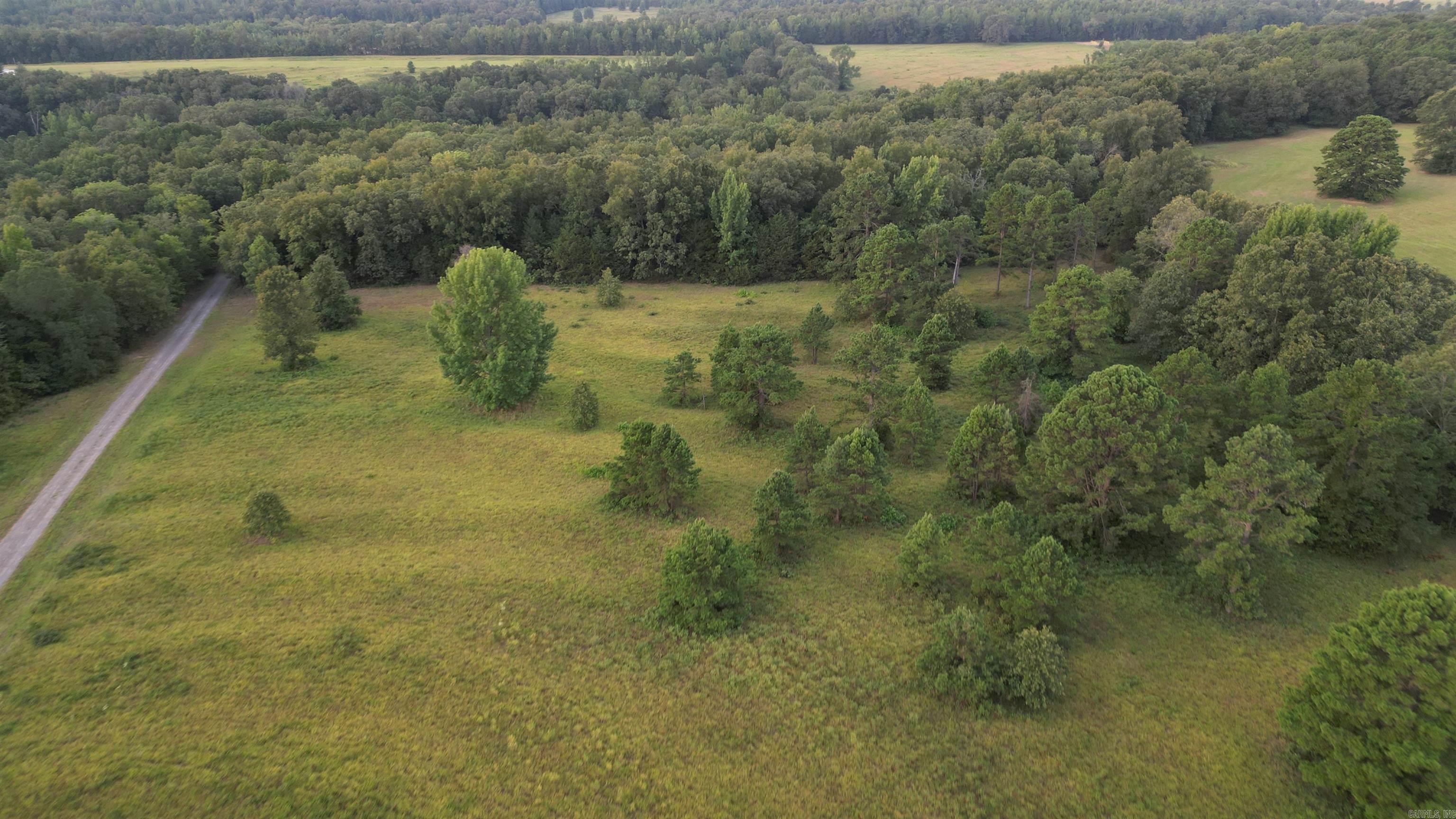 Come check out this remarkable land before it gets away. Discover the perfect blend of serene meadows and lush woodlands on this stunning 20-acre property in the rolling hills of northern Faulkner County. Nestled amidst gentle hills, this land offers both open spaces and shaded areas, ideal for hunting, fishing, farming, homesteading or just creating your own haven away from the hustle and bustle. Enjoy the soothing sounds of Mill Creek as it meanders through the property, creating a peaceful and picturesque setting. Despite its secluded feel, the land is conveniently located less than 10 miles from Greenbrier, AR, providing easy access to shopping, dining, and other amenities. For aviation enthusiasts, the property boasts access to an FAA-registered grass airfield with a 2,800-foot runway, perfect for private planes and small aircraft. This unique property is a rare find, offering the tranquility of country living with the convenience of nearby town amenities. More adjoining land can be purchased as well. Donāt miss the chance to own a piece of Arkansas paradise! **Call today to schedule a viewing and experience the peaceful beauty of this remarkable land.**