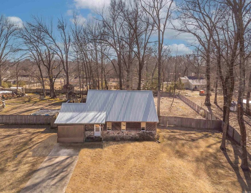 $5,000 in seller concessions to use to buy down your rate, help with your closing costs or updates! 5 yr old New Roof & less than 10 yr old newer HVAC! You have to check out this charming log cabin style home located in Greenbrier on over 1/2 acre of land! This spacious house has three bedrooms, two bathrooms, plus a very large bonus room! There is an open floor plan & a split floor plan with the primary bedroom being downstairs with its very own attached en suite. Upstairs, there are two more bedrooms with a full bathroom in between them. The bonus room is downstairs to the left of the kitchen & dinning room. This room also has backdoor that leads to a very spacious, completely fenced in backyard. There are 2 storage sheds that convey with this property; one is 8x12 and the other one is 9x9. The refrigerator & washer/dryer also convey with this home. There is high speed, fiber optic internet available in this area! This home qualifies for zero money down with a USDA rural development loan, FHA, VA, Conventional loan or cash so make sure to get with your lender to get qualified today! Award winning Greenbrier School District! Only 15 min North of Conway.