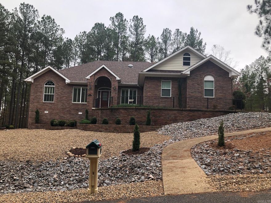 BACK ON THE MARKET-BUYER FINANCING FELL THRU. You will love all of the custom features this corner lot home has to offer! Full brick house with 3 bedrooms and an office.  Guest bedroom has french doors with a balcony off of it. Separate dining room and separate breakfast nook off of kitchen, maple hardwood floors thru out, quartz countertops, crown molding in every room and covered screened in patio. New roof Dec. 2023. New huge walk-in shower and huge walk-in closet added in 2022. Large laundry room with extra storage space. Irrigation system allows for easy watering for landscaping. Walk in crawl space with storage. Extra lot to rear conveys for extra privacy. See agent remarks. MUST SEE!