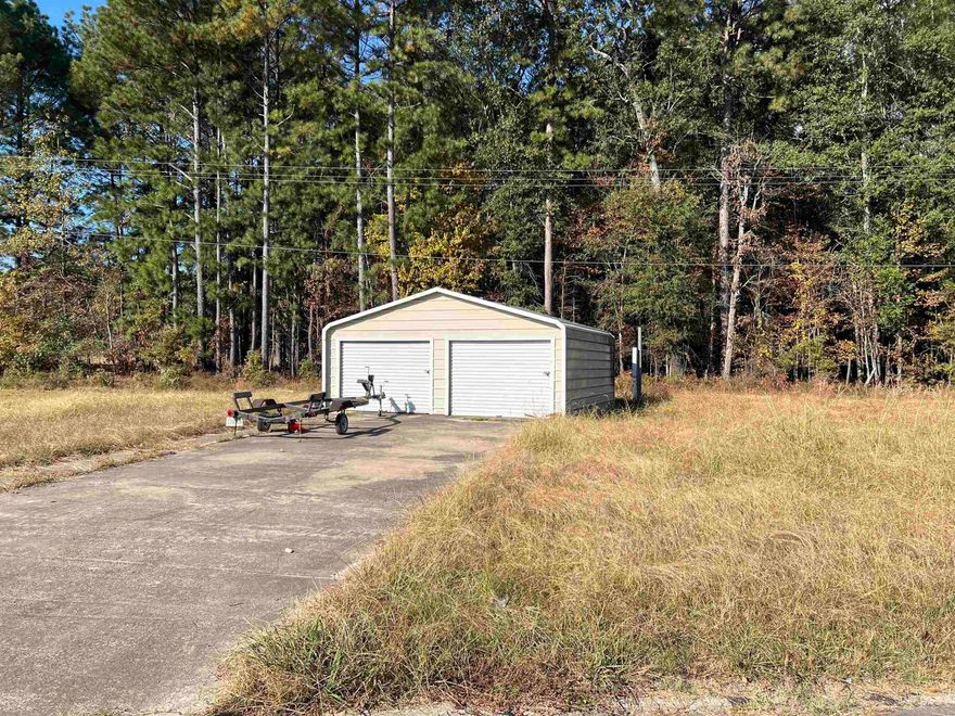 This quarter acre lot is ready for you! Currently being used as storage with a 20X20 shop, this land is just waiting for a new home to be added. No SPD.