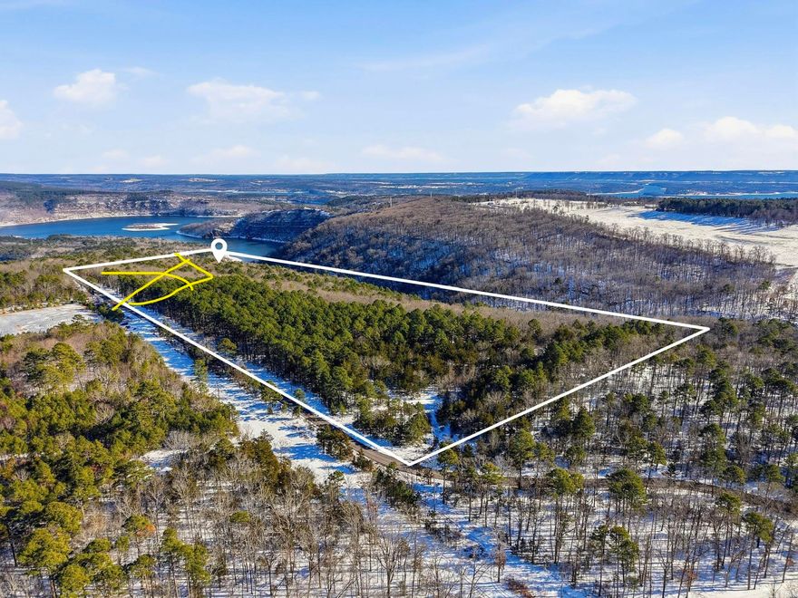 72 acres with over 1000 feet of Road Frontage, manicured ATV trails through the dense woods, GREERS FERRY LAKE VIEWS & OZARK MOUNTAIN VIEWS!! Also, just a short drive down Leech Dr. to the Public Concrete Boat Ramp and a short ATV ride to Fairfield Bay's 90 miles of ATV Trails, Two Golf Courses (Indian Hills & Mountain Ranch), Mountain Bike Trails, Hiking Trails, & more. City Water and Electric run along Leech Dr.  Wet Weather creek runs along the southside of the property.   OPTION to Buy ALL of the seller's acreage with New Home which includes 82.54 acres .... SEE MLS # 26004107 (address : 550 Leech Dr., Shirley, AR 72153). Address for acreage TBD.