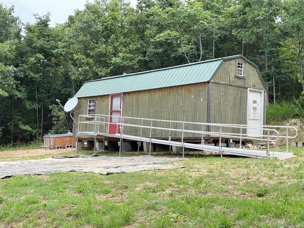 Great opportunity to finish your home or vacation getaway the way you want it. Dwelling is 32x11.4, One open area with room for bedroom, kitchen, living & bath. 2 lofts for storage or beds. Building has electric and is insulated in walls and ceiling. Working drilled well is ready to be plumbed into home. Dwelling needs partitions, plumbing, finishing and septic system. 11x20.4 storage shed has concrete floor. All situated on 4.61 secluded acres in Northern Marion County. Minutes from Hwy 125 Marina and Peel Ferry crossing on Bull Shoals Lake. Approx. 45 minutes to Harrison and White River, and one hour to Branson, MO, and Buffalo River. Great location from which to to explore and enjoy the Ozarks!