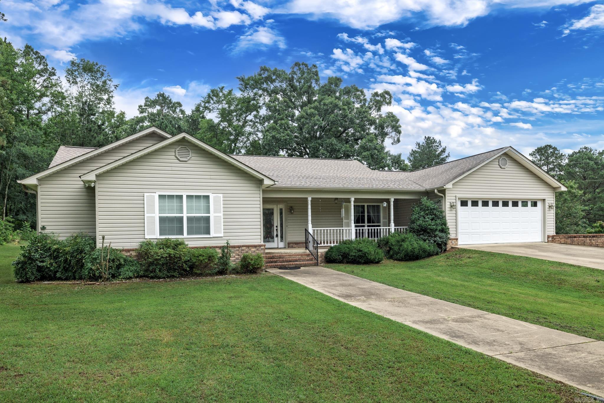 Welcome to your private retreat in the highly sought-after Bismarck area! This beautiful 3-bedroom, 2-bath home offers 2,706 square feet of comfortable living space, perfectly situated on 15.21 acres of peaceful countryside. Tucked away in nature, yet close to Hot Springs, Arkadelphia, or Malvern, this property offers the best of both worlds. Inside, you'll find a spacious and inviting layout with a versatile bonus room that can easily serve as a fourth bedroom, sunroom, game room, home office—or anything your lifestyle needs! The possibilities are endless. Outdoors, enjoy the natural beauty of a picturesque creek that gently meanders through the property, adding serenity and charm to your surroundings. The land is ideal for those who love space, privacy, or the great outdoors. Need room to work or play? You’ll love the massive 40x40 shop, complete with a 16x40 lean-to and a 21x40 lean-to—perfect for your RV, boat, tools, equipment, hobbies, or extra storage. Whether you're dreaming of homesteading, entertaining, or just relaxing in your own private oasis, this rare Bismarck property is the perfect place to call home. Don’t miss out!
