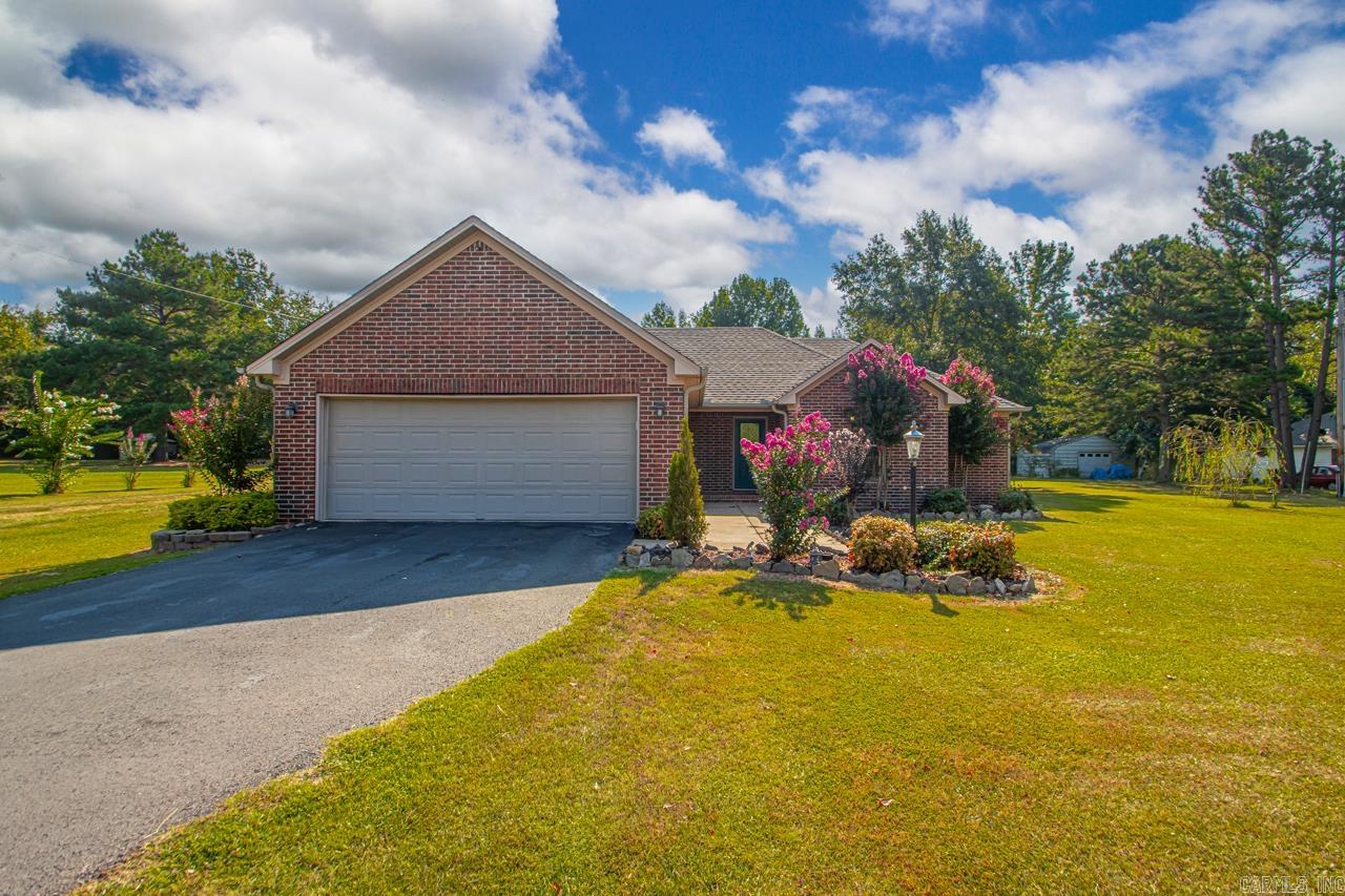 Welcome to your private retreat in Wooster! This 3-bedroom, 2-bathroom home sits on 1.25 acres & offers the perfect balance of comfort, functionality, and space to enjoy the outdoors. Inside, you’ll love the split floor plan with spacious bedrooms, a master suite featuring a double vanity, & a bright kitchen with a breakfast bar, abundant counter space, & cabinets for all your storage needs. The oversized laundry room adds even more functionality, while the large garage provides additional storage options. The backyard includes a private patio with fencing, plus a second fenced area perfect for pets, gardening, or play. A chicken coop and duck coop add to the charm for those wanting a touch of homestead living. The oversized shop is a true highlight—complete with RV parking, electric, water, and&septic, along with tons of storage for hobbies, tools, or business needs. Whether you’re hosting gatherings, raising animals, or looking for a property that supports both relaxation and productivity, this home delivers it all. With its great location just minutes from Greenbrier and easy access to Conway, you’ll enjoy the peace of country living with the convenience of town nearby.