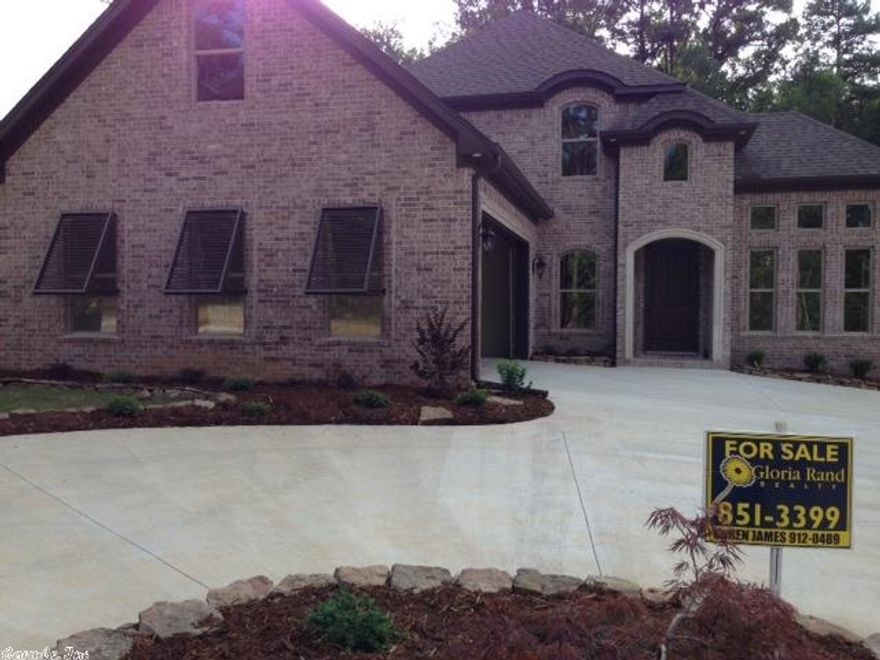 Beautiful elegant home with 3 bedrooms, 2.5 baths, open kitchen to great room & breakfast area! All hardwoods except in bedrooms & bonus room. Granite tops in kitchen & bathrooms! Fireplace on back covered porch with attached deck! Sprinkler system with lots of landscaping & circle driveway!