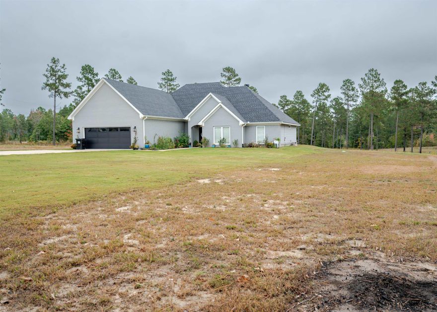 Welcome home to this stunning 4-bedroom, 3-bath modern farmhouse set on 9.5 serene acres! Inside, you’ll find a bright and open floor plan featuring a spacious living area with a cozy fireplace, a beautiful kitchen with granite countertops, stainless steel appliances, and a large island perfect for entertaining. The primary suite offers a spa-like retreat with a soaking tub, tile shower, and dual vanities. Enjoy the bonus room upstairs — perfect for a playroom, office, media spacer could be a 5th bedroom. Step outside to relax under the covered patio with a fireplace and peaceful wooded views. This home blends comfort, style, and privacy just minutes from town — a true country oasis!