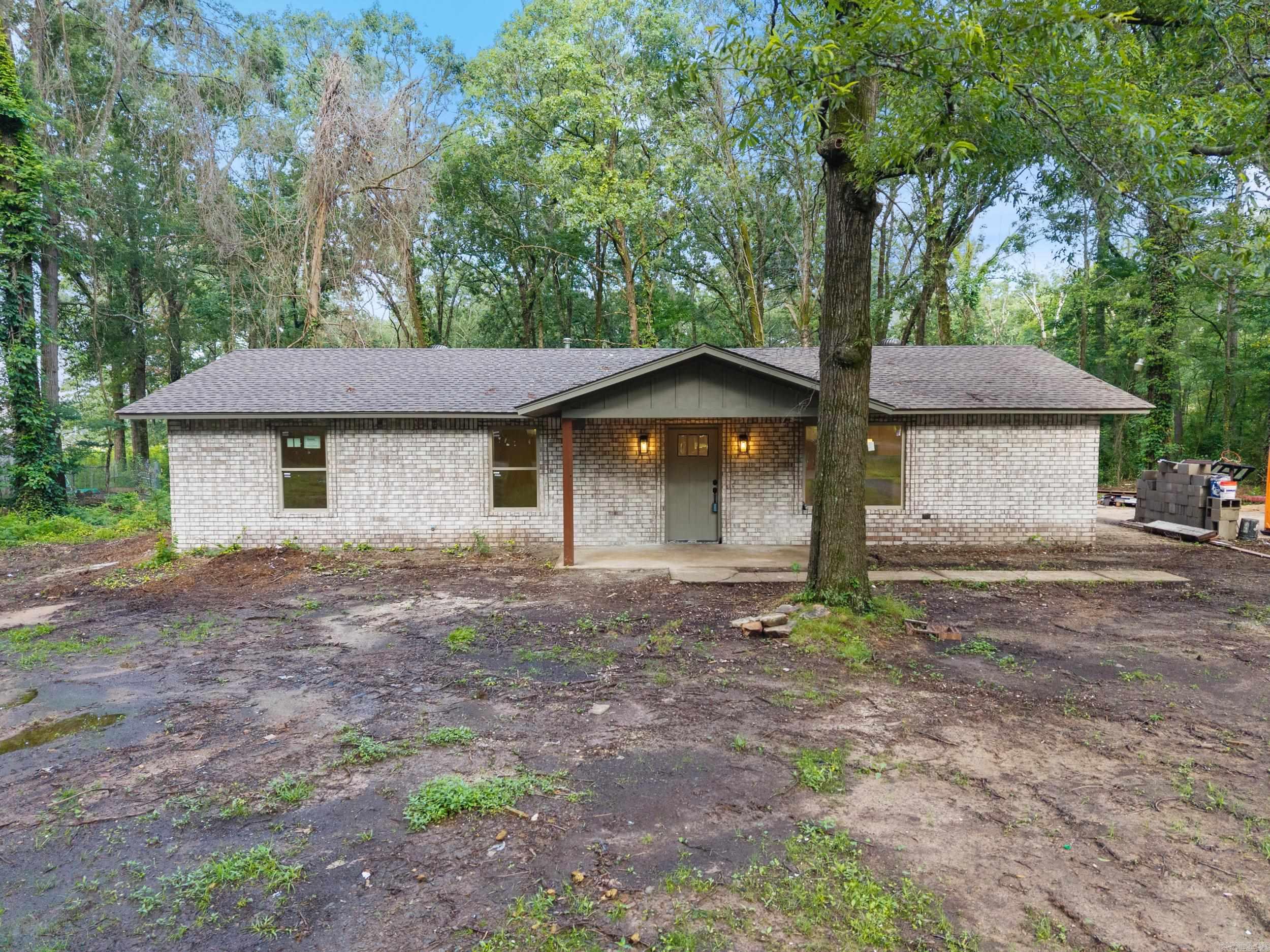 Stunning complete remodel! Don't miss this updated 3 bed, 2 bath home on .61 acres +/- in Conway. New roof, new windows and doors, new exterior wood siding and brick, all new electric and plumbing, new HVAC, tile bathroom/showers, LVT flooring throughout, granite counters in both kitchen and bath, recessed can lighting throughout, new appliances/gas stove range, new cabinets, large concrete pad for outdoor living, covered front porch, pantry with electric, open floor concept, laundry room/mud room, AND flex room! Be sure to click the links for the 3D tour and drone footage. Home will be completed by closing. Yard will be seeded, and flower bed will be added.