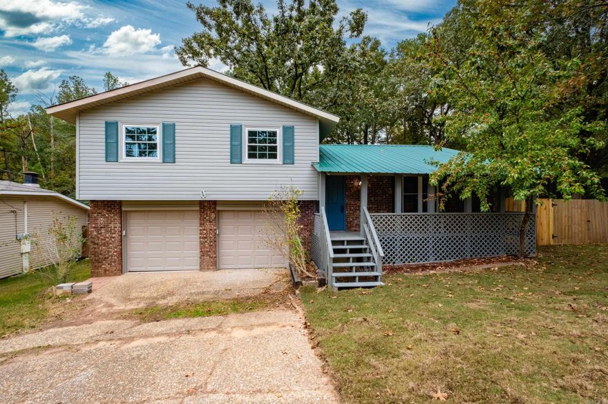 Welcome to this charming completely updated 3-bedroom, 3-bathroom home nestled on a quiet, private street. New LVP flooring throughout the home, New Cabinets, New Lighting and Plumbing Fixtures, and Slab Granite. With two spacious living areas and a wood burning fireplace there is plenty of room to relax and entertain. Large laundry/mudroom conveniently located off of the garage.  The eat-in kitchen with appliances, cabinets, and slab granite countertops offers a cozy space for meals. This home also features a two-car garage for convenience and ample storage.  Fully fenced backyard.