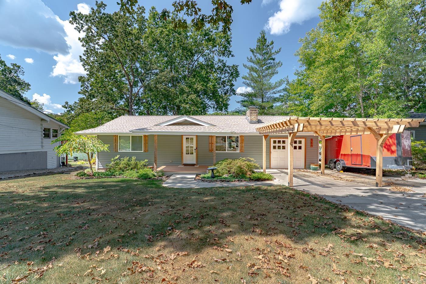 Welcome to 244 E Lakeshore Dr located on Lake Sequoyah in Cherokee Village, AR! Lake living truly at it's finest! With a custom kitchen, indoor and outdoor renovations like a new roof in 2022 (transferrable warranty available), custom carport in 2020, new boat dock in 2023, and much more! This home has 3 bedrooms and 2.5 bathrooms with a level lot right on Lake Sequoyah (if you know, you know) and is ready for you to move in and immediately enjoy! Pontoon boat and most furniture negotiable. This one will not last long, schedule a showing while it's available!