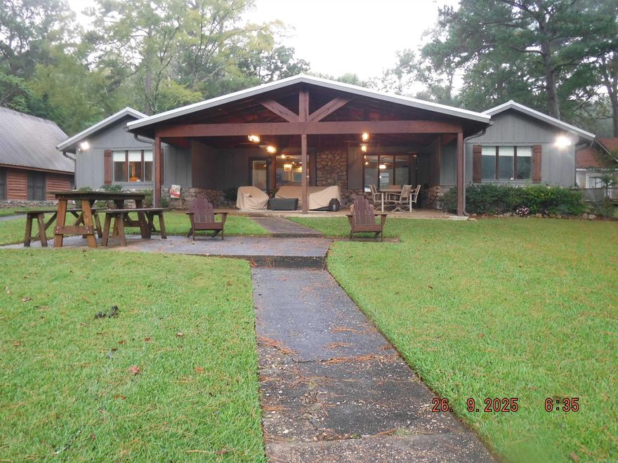 Charm & character await you in this fully updated & beautifully renovated lake home. Situated on a double lot & surrounded my mature trees & plenty of paved parking. This home features 4 bedrooms & two full bathrooms. A semi open concept living/dining/kitchen areas & windows all along the lake side invite you to enjoy the view from many vantage points. Lake side you are greeted by the new vaulted back patio area that brings you right out to the lake & your 2 stall covered boat dock & sea do pad. You can enjoy hanging out in "your" cove or you are just a few doors down from main channel water where you can enjoy skiing, dining, and people watching. Or hook a left and hit the cold water dam.  Updates include - Cross linked PEX water lines inside to prevent freezing. New hot water heater. All new SS appliances. Completely new master bathroom. Board& Batten/paint on exterior of house & garage. Front/back doors. Vaulted back patio, fans, fixtures, HVAC, metal roof. Woods across the street are part of Hill Wheatly Park & will not be built on. Hill Wheatly Park w/ beach & boat launch one street over. Don't miss this wonderfully appointed lake home in a prime lake location by car or boat.