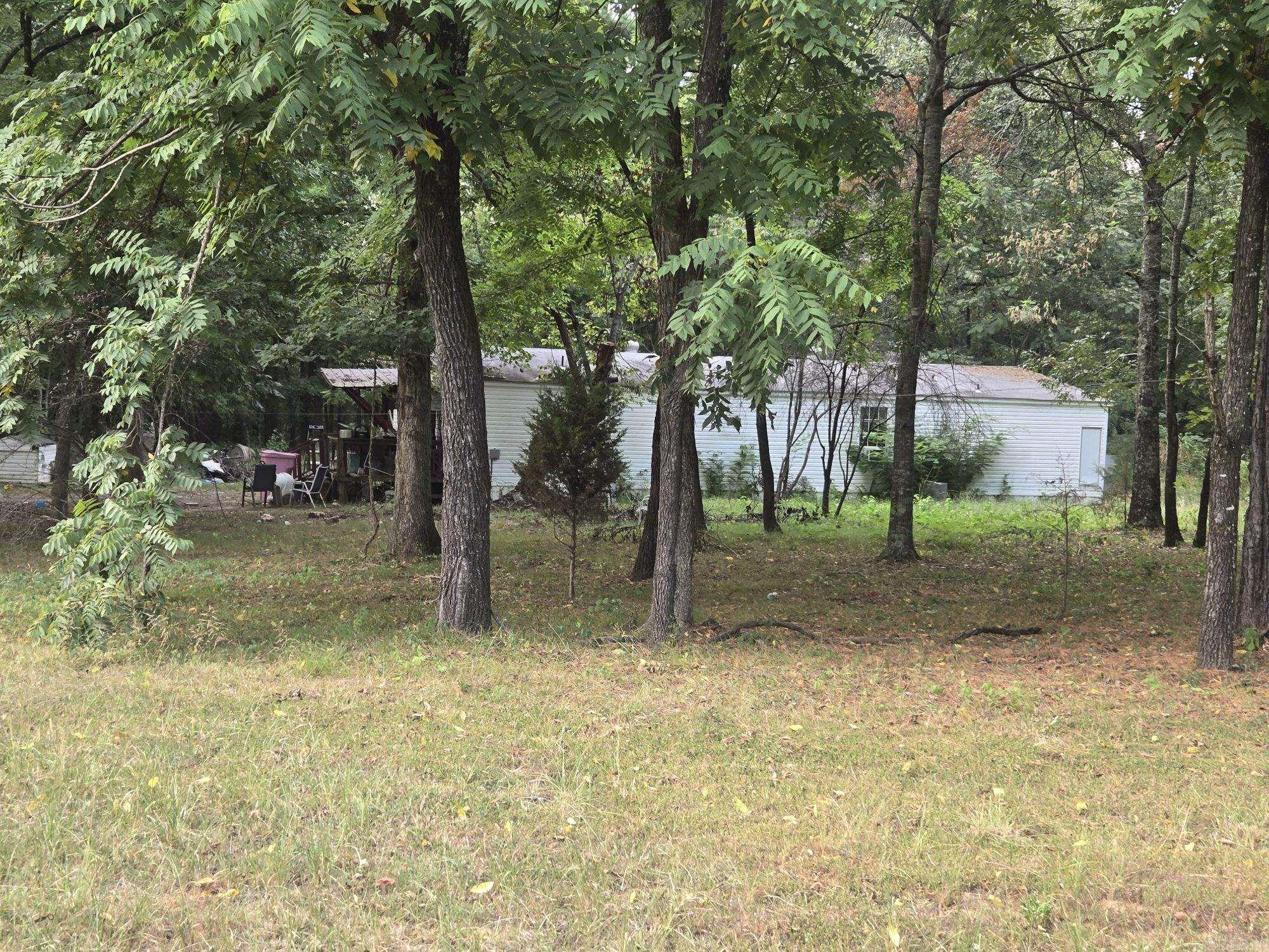 A hunter's or nature lover's paradise! 5.04 Acres of land has a 2001 fixer upper mobile home. If you're handy, you can remodel and make it your own. Electrical utility and well on property. If you want Municipal water its available at the road. Wooded and ready for a new family to enjoy! Look at the awesome opportunity to put your personal touches. At this great price point, the sky is the limit.