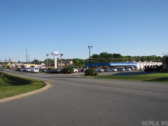 Location, location! Main Street! Fronts major light signal opposite Kroger & Walgreens amid Cabot's busiest hospitality & retail sector. This 1.5 - 3.62 ac site is ready for large scale development or expansion of existing building. Currently a car dealership w/4,800 sf office & showroom; 8,400 sf service dept & garage; 18 overhead doors, including 7 drive-thru bays & detail shop. Population over 5,000 in a 1 mile radius, 38,250 within 5 mile. Highest traffic count in Cabot, 21,000 vpd.