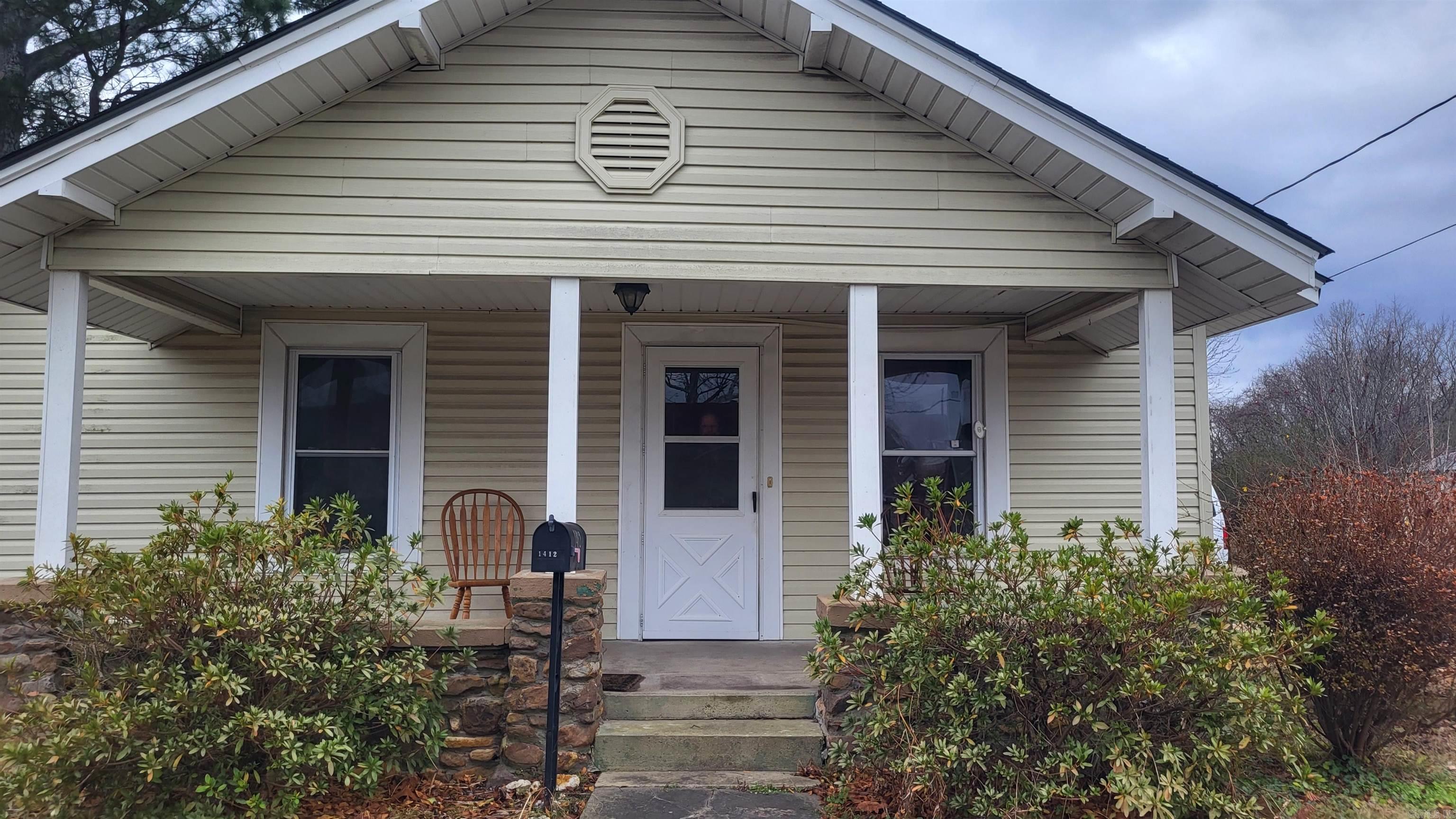 Cottage style home on double lot. Recently installed solar panels (Dec. 2023) provide extra security if the power goes out. 18x20 shop, fully insulated, roll up door, lean-to w/plugs & LED lights. Fenced yard, garden area, landscaping. Inside, home has wood floors, gas range, refrigerator stays, separate dining room, gas space heaters, 4 window units for cooling. Worth a look!