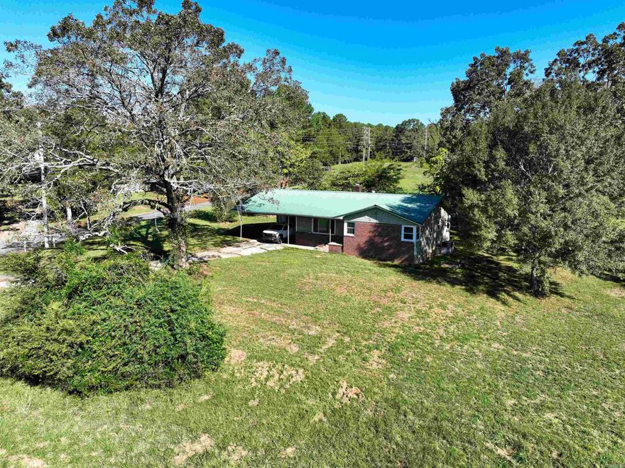 A rare residential and/or commercial development opportunity just outside the city limits of Heber Springs, offering panoramic views of the iconic Sugarloaf Mountain in a prime location near the Little Red River awaits. This property features 375 feet of Highway 110 E frontage, nearly 1000 ft of Sugarloaf Ln frontage, nearly 6 acres of developable land, and a 1,454 SF home with authentic polished wood flooring and fresh interior paint throughout! The land is cleared and ready for an investor or business to maximize its potential. The front acreage is ideal for commercial development, mixed use, restaurant, medical, or retail, while the back acreage could be reserved for residential use. Alternatively, the entire property presents a turnkey opportunity for an RV outdoor living park, or auto park with a design for additional commercial use on site as well. Sugarloaf Ln is Located directly across from the Sugarloaf Dance Hall, Mountain Trailhead system, and a short walk to the ASU Beebe Commuter Campus, this property is perfectly positioned for visibility and growth.