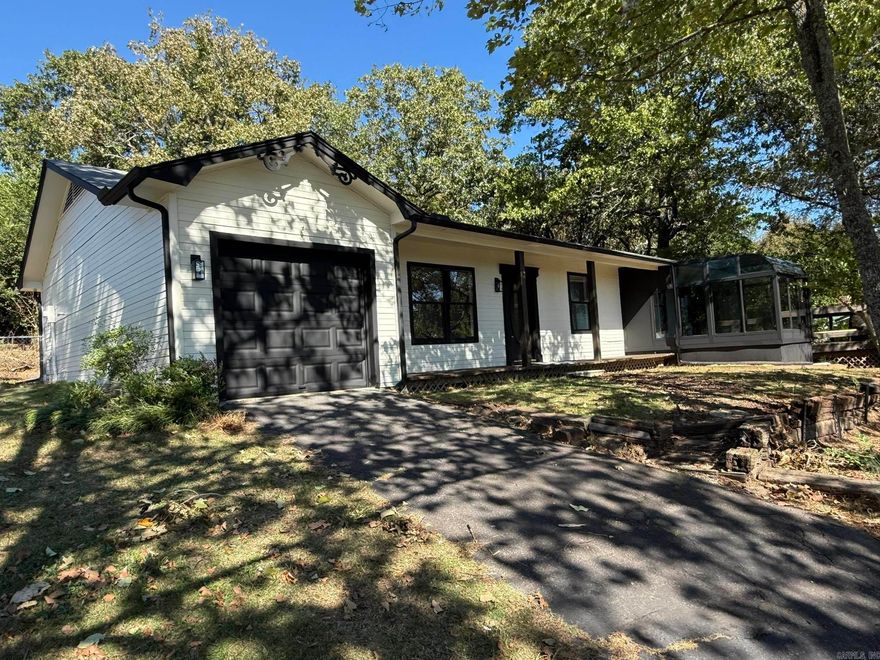 1,489 sq. ft. 3 Bedroom, 2 Bath newly remodeled home. 20 mil Luxury Vinyl plank flooring, new paint and fixtures. One car garage with additional parking pad. Private .72 acres with an amazing view. $30k sunroom addition installed by previous owner. Fenced area for pets. Large laundry room. Wood and gas fireplace. The quiet neighborhood with a country feel yet still close town. The view is amazing, house is laid out well with large laundry room.