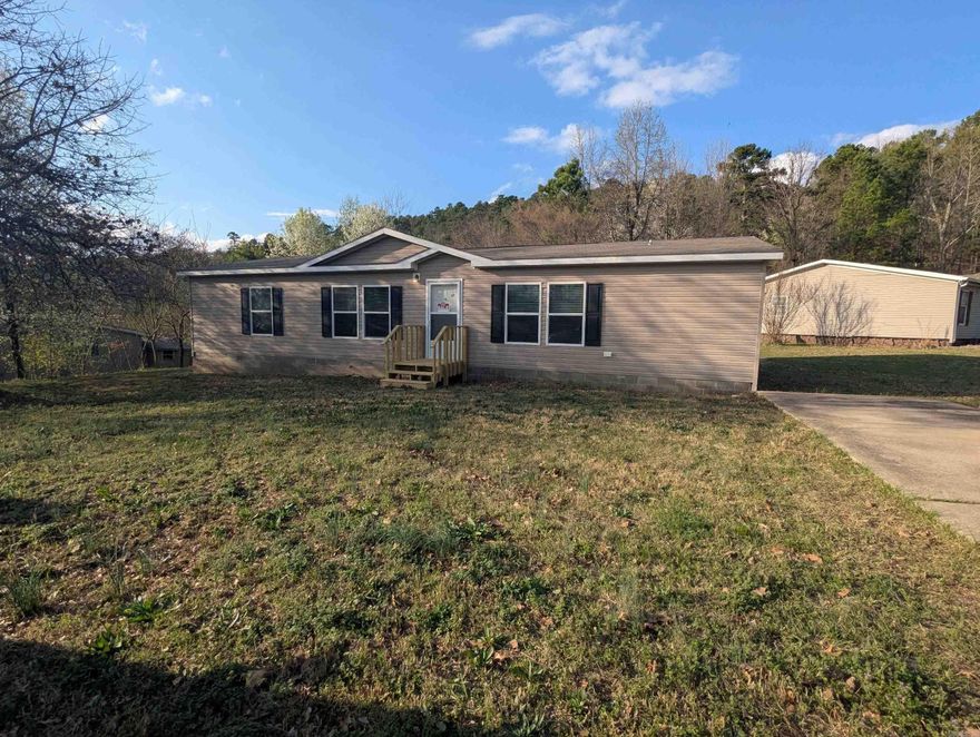 Welcome to 227 Mount Tabor! This 3-bed, 2-bath mobile home features a spacious floor plan, brand-new porches, and a paved parking pad. Situated on a nice flat lot in a clean, well-maintained community off Albert Pike Road.