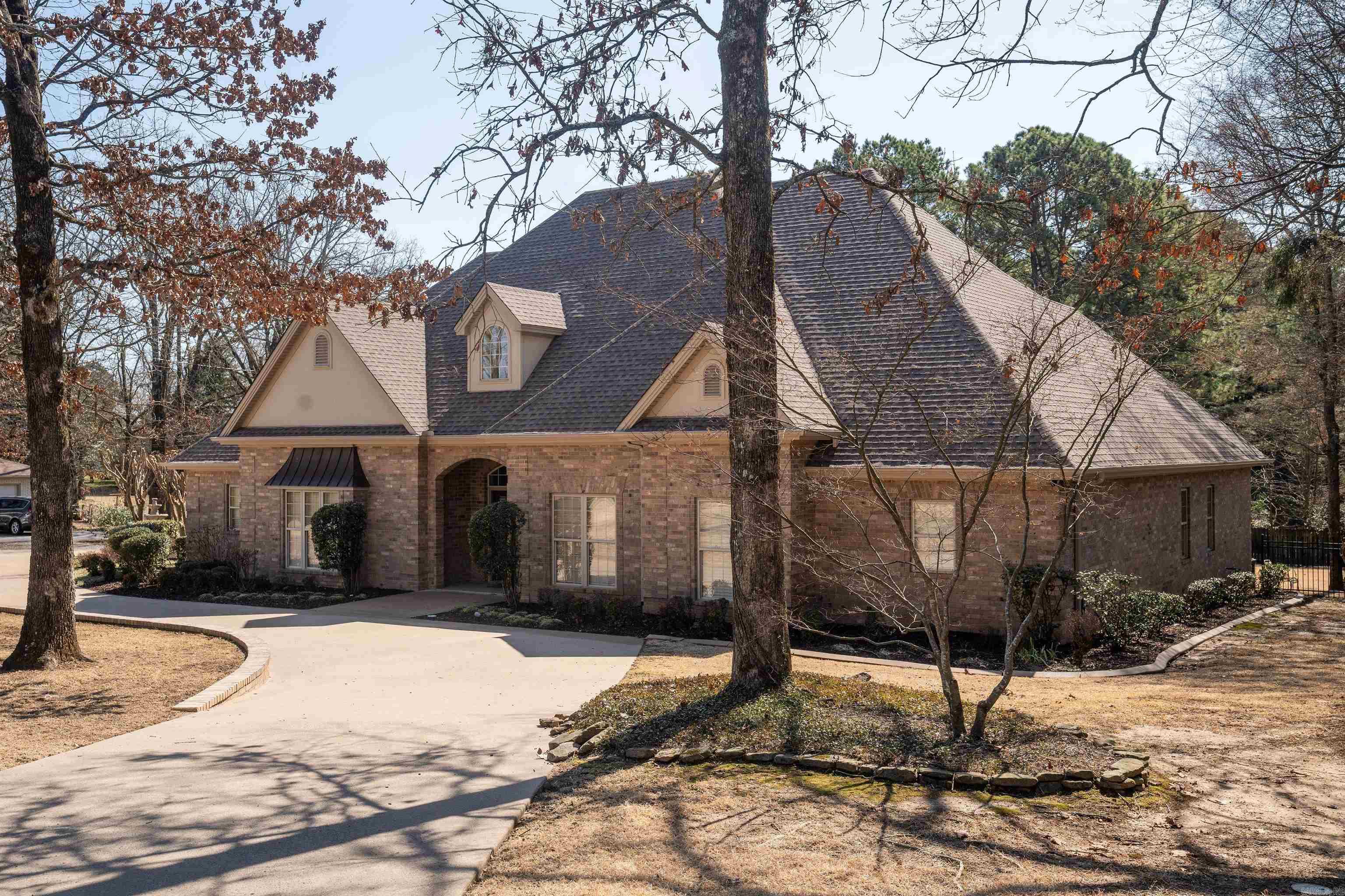 This listing describes a stunning 5-bedroom, 3.5-bath, custom built home located in the heart of Searcy, offering both convenience and charm. Situated on a generous 0.92-acre lot, the property boasts significant curb appeal. The main level features three bedrooms and 2.5 baths, along with a large living room perfect for gatherings, a separate dining room, den, and a spacious office, and a laundry room. The upper level provides additional space with a large bonus room, a full bath, and 2 bedrooms, ideal for guests or extended family. The main house includes a 3-car garage, providing ample parking and storage, while an additional workshop offers extra space for hobbies or projects. This home seamlessly combines functionality and style, making it an ideal choice for those seeking comfort and convenience. Call Today to Tour!