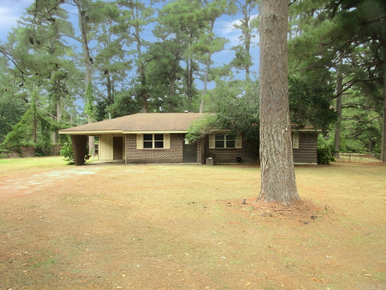 Let's go see this 3 bedroom, 2 bath brick home located on a spacious corner lot. Large family room with fireplace for entertaining. Partially fenced yard, and a shop. South of Pine Bluff, outside of city limits. Taxes are before Homestead Credit. **See Remarks** Call today and take a look.