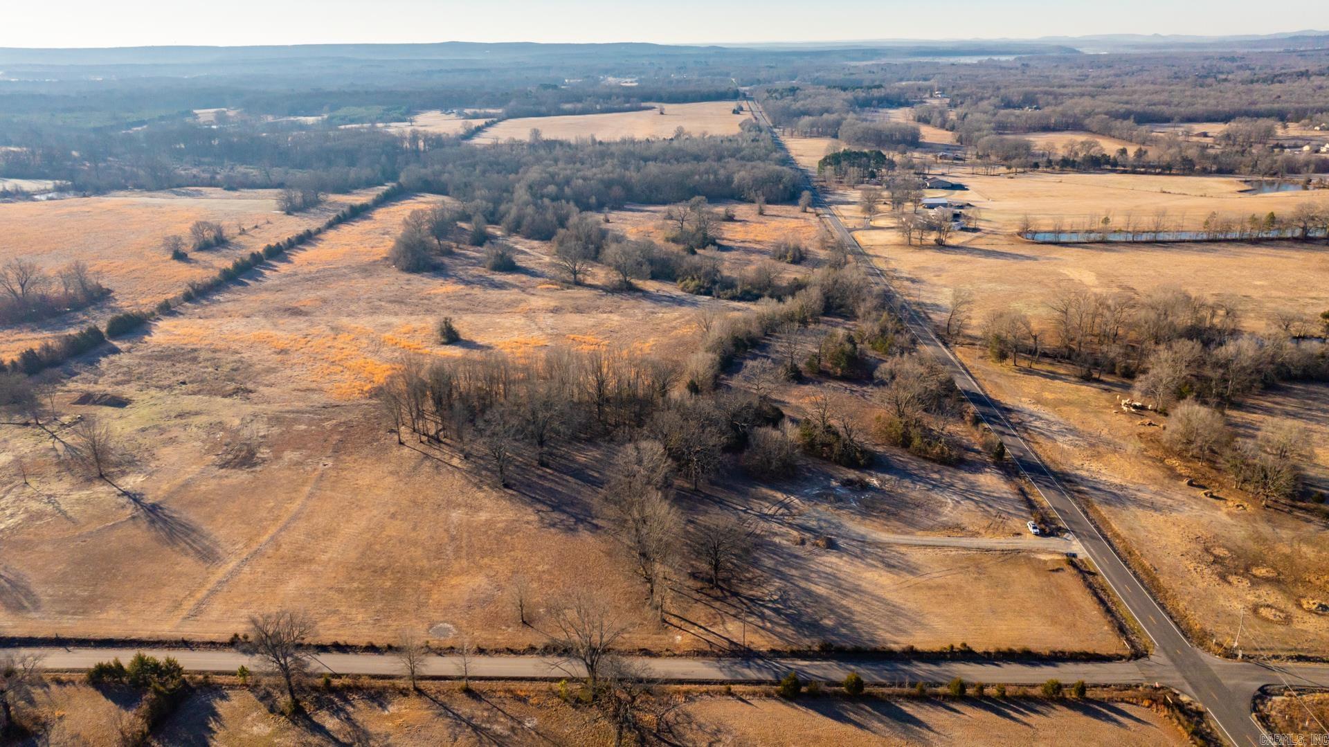 Looking to build your dream home on large, hard to find lots convenient to everything? Discover these 5-7.5-acre level lots partially cleared, but with beautiful trees for endless possibilities. You don't want to miss the chance to build in a country setting but close to city amenities. Pictures coming soon