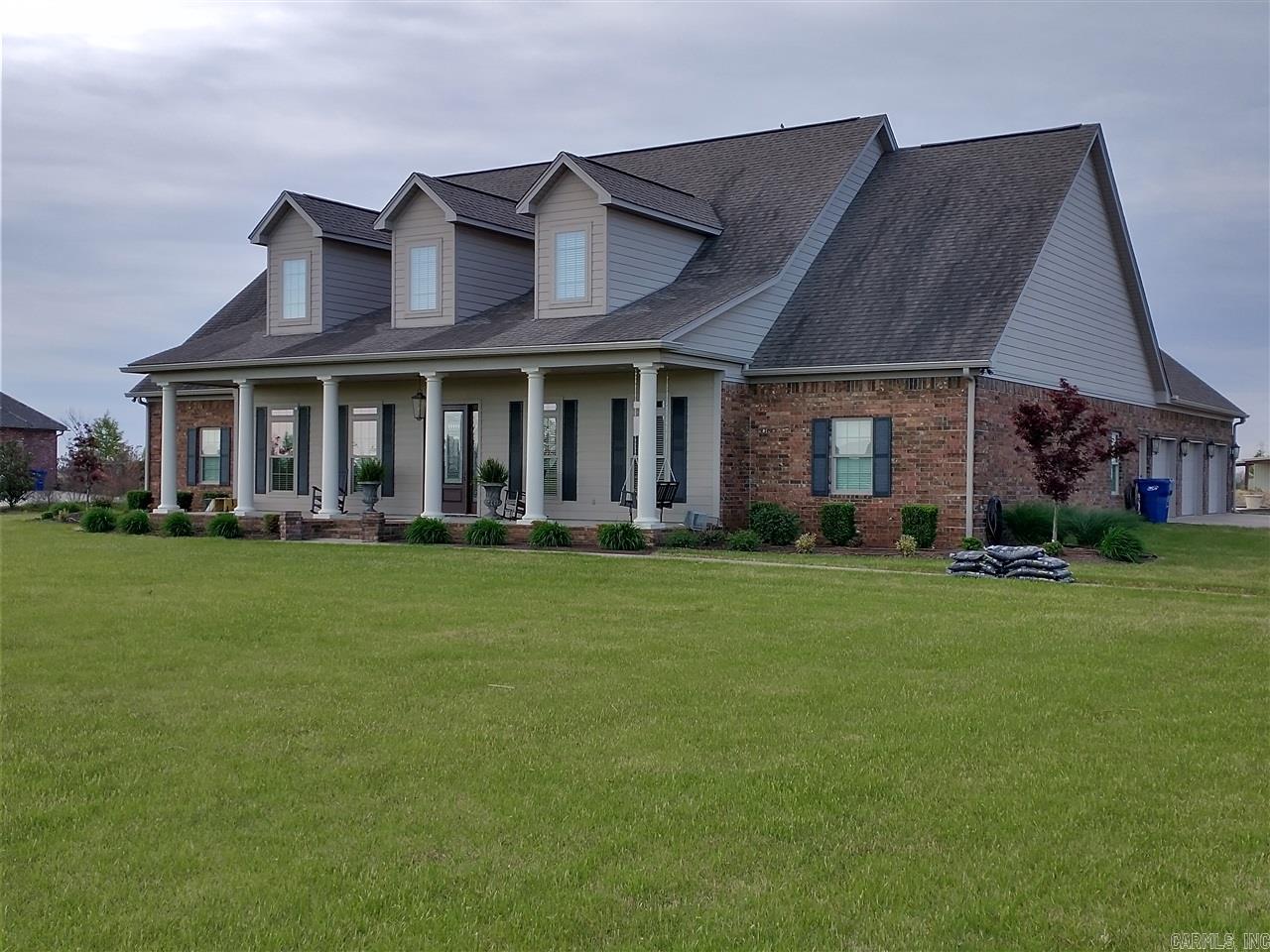 This beautiful custom built home is only 8 years old. High quality is apparent everywhere. Large well-appointed gourmet kitchen has abundant cabinets, double ovens, built-in microwave, island with cooktop and a large breakfast bar. The large master suite with safe room/master closet is on the main floor as well as 3 more bedrooms, 2 other bathrooms, large laundry room, office with built-in desk/shelves, formal living & dining rooms & a family room. The 2nd floor boasts a game room, guest bedroom and a full bathroom. The open floor-plan is perfect for entertaining as is the screened patio and sparkling 18x42 pool. It was designed to be very energy efficient with too many amenities to mention. It sits on a 3.45 +/- acre lot with a shop at the back of the property that includes a heated & cooled bedroom with full bathroom. Call Leah Williams for your personal tour. Info taken from the tax card and blue print of the floor plan.