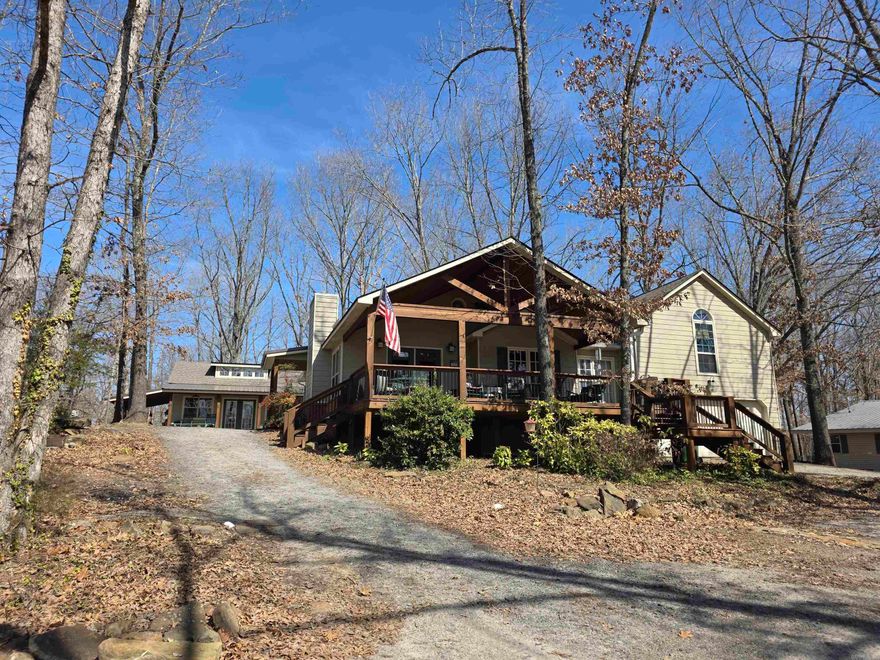 This charming lake area home has been owned by the sellers since 2003 and is in the very pretty neighborhood of Skypoint Estates. Beautiful lake view and local area boat launch within walking distance, right across the street. Custom built shop that is heated and cooled. Could stay as a workshop or make for extra sleeping quarters/bunkhouse. (would need to be plumbed for water if you wanted) Skypoint Estates does have a private airstrip and is just right around the corner from this house. Primary bedroom is above the garage and is completely separate from main floor. Very close to town and within 5-6 miles of all surrounding marinas and local shopping.  Agent see remarks.