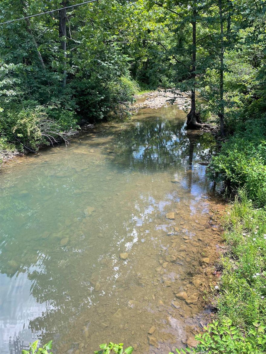 Beautiful 14.78-acre Ozark Mountain tract with privacy, mature timber, natural clearings, and a seasonal creek. This mostly wooded property offers the perfect mix of seclusion and accessibility, with utilities available on site. A great setting for a getaway, future home, or peaceful retreat surrounded by nature.