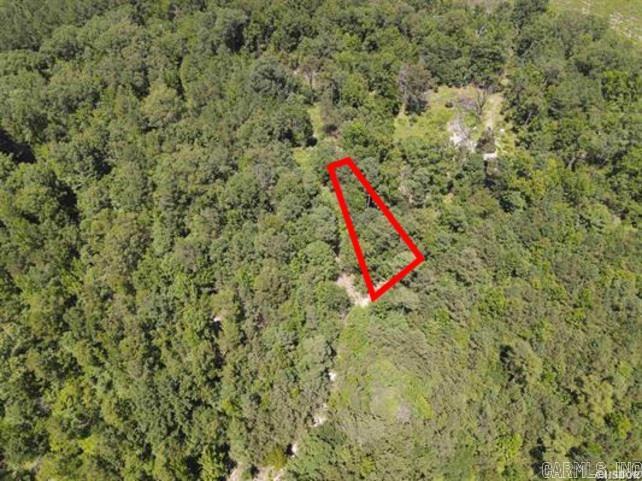 Your peaceful retreat awaits! This 3.10 acre property is a chance to slow down and reconnect with nature, and create the home or getaway you’ve always dreamed of. With utilities (electric, Kimzey water, fiber optic) already at the road, just need septic and your vision. Nature lovers will appreciate the abundant wildlife, including deer, turkey, and even the occasional bear, thriving on land that has been preserved for generations. The balance of untouched plant and animal life makes this a true haven. Perfectly located just 20 minutes from both Hot Springs and Lake Degray you can enjoy the best of both worlds, quiet country living with easy access to town, lakes and recreation. Additional acreage is available! Trade the hustle & bustle for fresh air and the kind of peace you can’t put a price on. Please note: Picture highlighting the tract is approximate. See survey for dimensions of the property. The county maintains the road. Seller does not own mineral rights. Cameras are in use. Contact listing agent for more details and to schedule your private showing.
