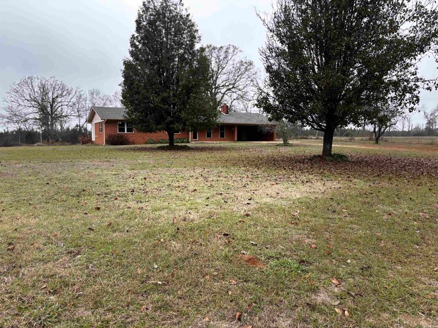 Far from the city lights, this newly remodeled 2,000 sq ft home sits quietly on 27 acres at the end of a private road—offering privacy, space, and a true taste of Arkansas countryside living. Inside, you’ll find 3 generous bedrooms, huge walk-in closets, along with a unique Jack & Jill bathroom suite that provides both convenience and separation for family or guests. The kitchen has been beautifully updated with all-new appliances that convey, and the adjoining sunroom offers flexible space for an office, hobby room, or additional living area. An attached, below-grade storm shelter adds peace of mind and could easily be converted into a secure walk-in gun safe.  Outdoors, the fully fenced pasture is ready for livestock or a small cattle operation, while a stretch of woods practically begs for a tree stand overlooking the spring-fed creek where deer sign is abundant. If hunting isn’t your style, spend slow afternoons by the pond—fishing, reading, or simply enjoying the quiet. Feel miles away from everything while still being just minutes from I-30 for an easy commute. Properties like this don’t come along often.