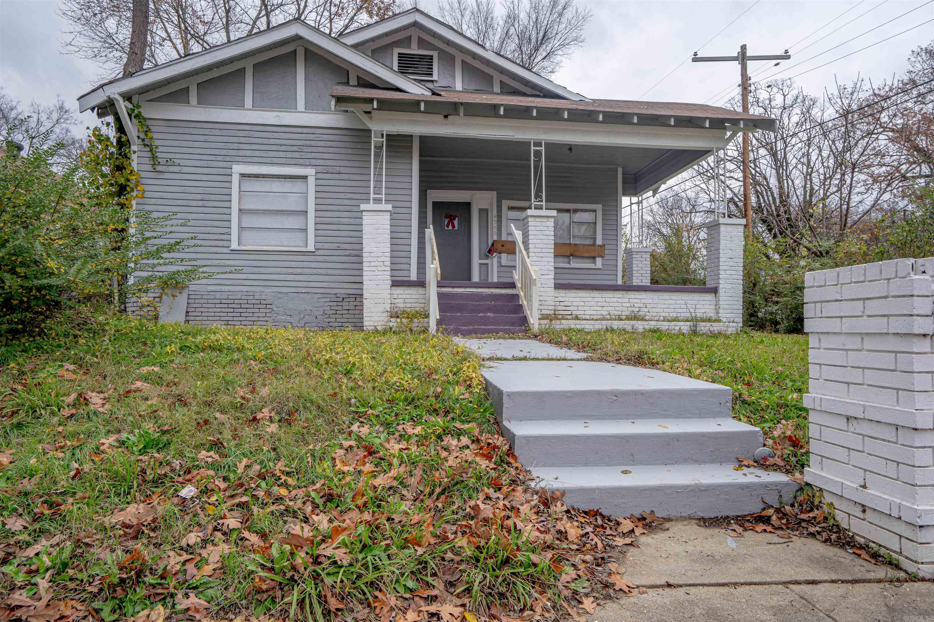 Property sold as-is, where-is. No Sellerās Property Disclosure available. Spacious corner lot with parking pad behind the home. Features 3 bedrooms and 1.5 bathrooms, with the primary bedroom located upstairs. Includes a gas fireplace. No central HVAC; a mini split system and several window units are currently in place. Roof age is unknown.