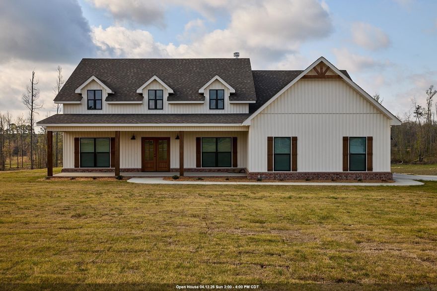 New construction in a growing area of Bauxite featuring 3 bedrooms, 2 bathrooms, and 2,217 sq ft. You’re greeted by a large front porch with double front doors and a side-load garage. This open-concept home offers a vaulted, beamed living room ceiling with a woodburning fireplace, hardwood floors in the main living area, carpeted bedrooms, and tile in wet areas. The kitchen includes quartz countertops and a walk-in pantry. Just off the foyer is a versatile office or dining room with a closet. The primary suite features a soaking tub, walk-in shower, double vanity, and private water closet. Additional highlights include a mudroom, a separate laundry room with sink and folding area, and a spacious backyard.
