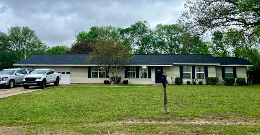 This updated 2 bed, 1 bath home offers 1,452 sq ft of living space with a flexible layout, including a walk-through room that can serve as a third bedroom or office leading into the primary suite, wood burning fireplace in the living room.   Situated on 1.86 acres, the property provides space to expand, garden, or enjoy a more private setting. Recent updates include a new roof in 2024 and interior improvements throughout.  Outside features include a fenced backyard, established garden areas, a pear and peach tree, and a designated chicken coop area. A standout feature is the 1,200 sq ft fully insulated red iron metal shop on a concrete slab  and additional room for vehicle parking or workspace. There is also a 250 sq ft "she shed " or storage building with electric. The attached 2-car carport offers additional covered parking and potential for future conversion.  Move-in ready with land, outbuildings, and long-term potential. Priced to sell.  SELLERS are motivated and looking to entertain offers!  Give us a call today