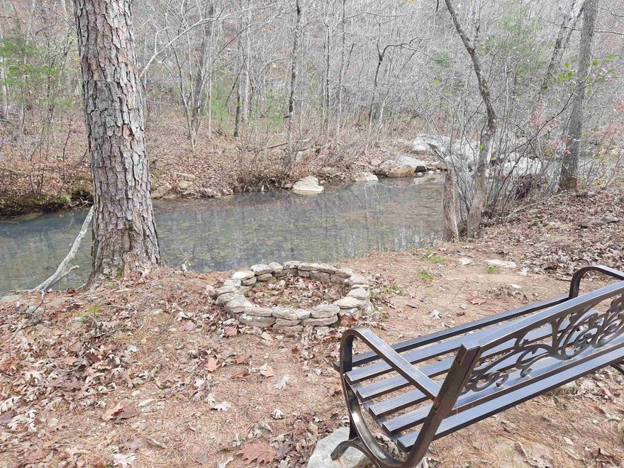 Discover the perfect escape with this 4.7 +/- ac creek lot on Brushy creek, you can sit quietly and listen to the singing birds and crickets, with the soothing sound of water flowing over the rocks. This property offers hwy frontage, easy access, but private, great for recreational use, park your RV for the week-end or very suitable for building.  This is a rare find so give us a call and take a look at this mountain retreat.