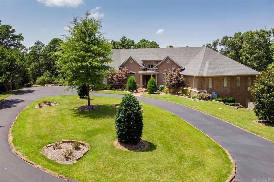 Secluded, private 5.54 acre custom gated, one owner retreat w/in-ground gunite pool & spa. Versatile floor plan, open living, plantation shutters, hardwoods, 8' door, whole home 48KW generator, & safe room. Chef's kitchen- 6 burner Viking gas cooktop, Viking frig, ice makers, granite island/breakfast bar. Travertine master bath, soaker tub, large tile 4 body spray shower. Game room, media w/mini kitchen in lower level. Dual patios w/outdoor fireplace & flagstone patio. Abundant storage. Elegant & serene.