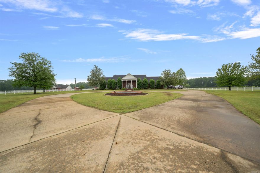 Executive Luxury with Indoor Pool & Gated Entry!  Discover luxury living in this impressive 3 bedroom 2.5 bath executive home spanning over 3700 sq. ft. From the moment you pass through the gated entry complete with a beautiful fountain and stamped concrete driveway you'll know you've arrived somewhere special! Inside, enjoy grand living spaces including an opulent den with fireplace, elegant living area, and a well appointed kitchen perfect for entertaining. The indoor gunite swimming pool offers year round enjoyment and is the ultimate in privacy and relaxation, or just sit and enjoy the fireplace, The spacious primary suite is a true retreat, with a wet bar with wine cooler, sitting room with fireplace and office area. Intercom and security system. While the two car garage adds convenience to this of of a kind property. This is more that a home, it's a statement.  THERE IS NO ADDITIONAL ACREAGE.  Call today to schedule your private tour of this exceptional property!!  See Agent remarks!