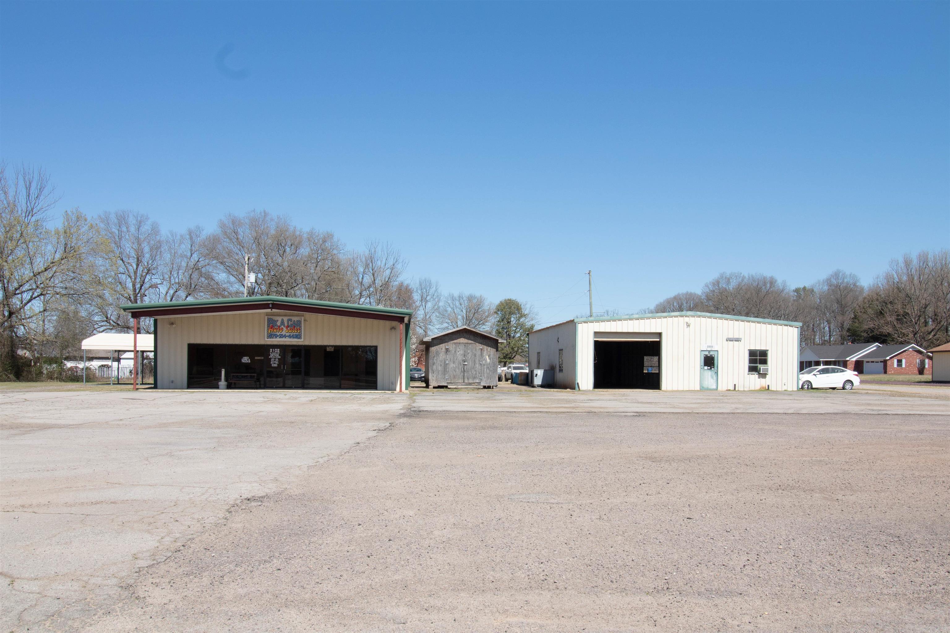 Discover the potential of this versatile commercial property, perfectly situated on approximately 1.5 acres of prime real estate. This property features a well-constructed 40x50 building that offers a functional layout with a main office, ideal for administrative tasks, and ample space for additional office setups. The building is equipped with 1.5 bathrooms and a dedicated break area, ensuring comfort for employees. Adjacent to the main building, you'll find a second structure that boasts an office area complemented by a substantial shop space. This shop is outfitted with a car lift and an air compressor, making it perfect for automotive or mechanical operations. Additionally, a convenient storage building is included, providing extra space for equipment or inventory. The expansive outdoor area allows for easy maneuverability and parking, making this property suitable for various commercial ventures.