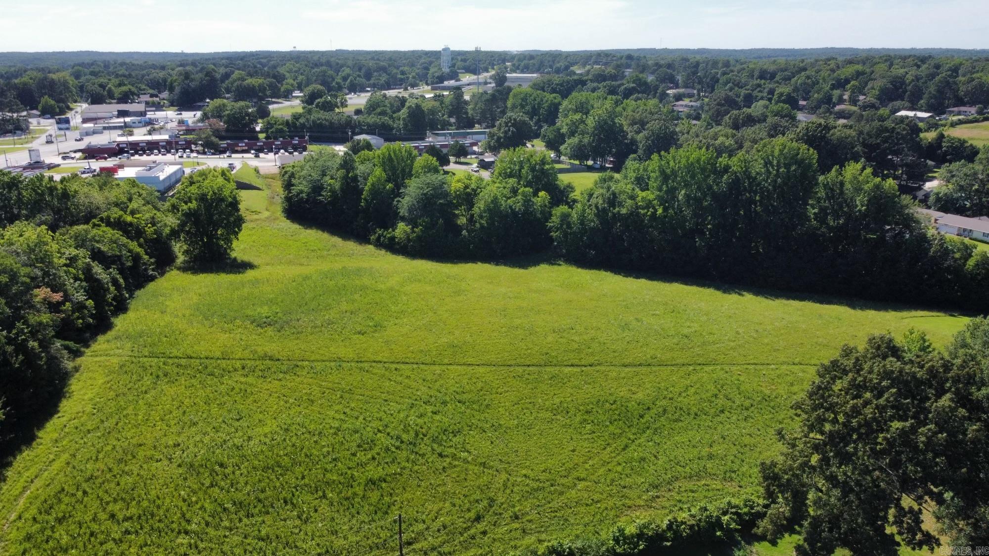 Beautiful Tract of Land, would be great to sub-divide for Single Family or Multi-Family Dwellings. Located behind the Kum & Go that is at the corner of HWY 412 West and N. Rockingchair Rd. It has 2 accesses off of N. Rockingchair Rd, one off Pleasant Meadow Dr and one off Church Hill Dr. Presently zoned R-1. City Utilities available on three sides of property.