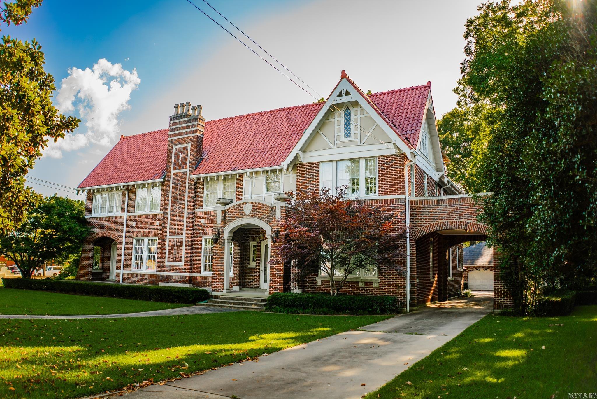 Conveniently situated blocks away from town square & local shops, this excellently maintained, unique, & characterful property could be yours! Boasting 4 bds (& large bonus room on the top floor w/ access to partially floored attic), 3 ba, 4577 sqft, on a .75 acre lot incased by a historical carved concrete barrier, this home has endless possibilities to suit a large family, OR for a business venture. Outside, stunning 1920's architecture, high-end landscaping, Spanish clay tile roof, & amenities like a detached 3 car garage & workshop, (potential ADU), covered patio w/ brick pavers, water feature, & balcony attached to the primary's sunroom, provide prime outdoor entertaining. Inside, there are many original features to love, from chandeliers, archways, french doors, hardwood flooring, stained glass, 3 fireplaces (2 of which are hand carved), 2 staircases, 3 sunrooms (2 attached to bedrooms). The updated luxury kitchen w/ granite countertops, custom panel front appliances including double door fridge/freezer, 2 dishwashers, & 2 cooled beverage drawers, as well as a mini glass door beverage fridge, Viking double ovens & gas range. Call to schedule your private tour today!