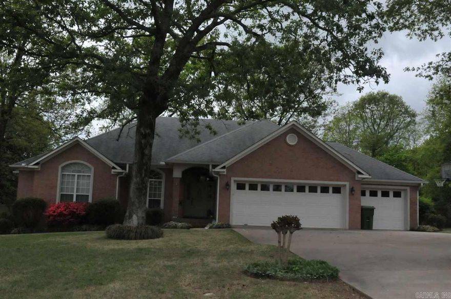 Great Buy in Club West.  Wonderful floor plan with 2 large Living areas (one with gas log fireplace!) and two Dining areas.  Master is split from other bedrooms, and MBA has separate tub and shower.  Beautiful hardwood floors throughout Living Areas, and recently updated tile in kitchen and baths! Also, new sink and range in kitchen.  Also has a 3 car garage.  Big tree shaded back yard is fully fenced.  Extra landscaping.  This one won't last!