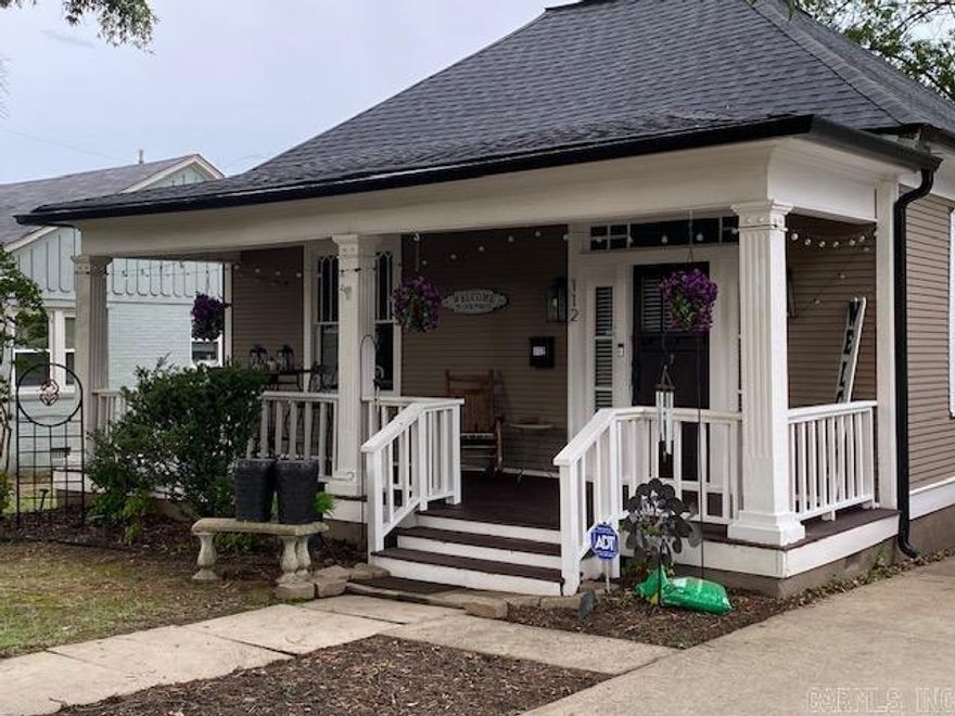 Beautiful 1900's home with loads of character and charm. Built to withstand all types of weather. Over-sized Family Room with beautiful hardwood floors. Kitchen has been updated and has a lot of storage. Primary Suite has a custom tile shower, with his and hers sinks. Shower is a walk in and the tub is a stand alone. Outside is amazing with a covered front porch, Large deck and patio is perfect for entertaining. A rare feature in this area is the large 2 car garage with a paved alley access. Large Oak trees in the back yard provide plenty of shade. Guest rooms are spacious and this home is just 5 minutes to UAMS. There is so much more to see, please call to take a tour.