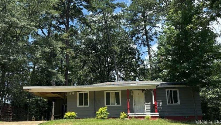 Attractive three bedroom home on large wooded lot. Near shopping and parks. Home needs major repairs. Great buy! RESERVE AUCTION PROPERTY- Property sold āAS-ISā without contingencies, repairs, warranties, guarantees or representation as to listing accuracy, property information, photo or other depiction included or described herein. Inspect before bidding.