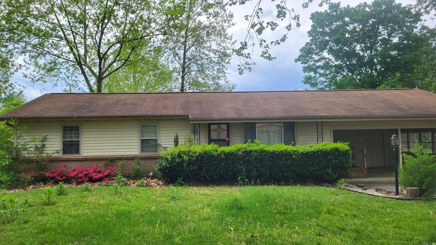 Nice home on extra large lot! New flooring, sunroom in back, laundry room with lots and lots of storage.  Outside storage building, 2 car carport, fenced yard.  Come see!!