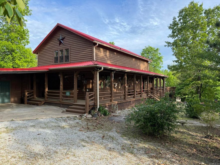 Welcome to Ridgeview: This stunning private Ozark Mountain retreat nestled on 8 acres has a spacious log home just minutes from Mountain View, where music, eateries, and shops fill the old Courthouse Square.  The home boasts high cathedral ceilings, stained glass windows, and large windows that bring the beautiful mountains and skies inside!  The property has large wrap around porches, large fire-pit with seating, as well as other large decks to make outdoor living inviting. There is abundant storage both inside and out.  This home mixes rustic with luxury to give that private paradise you will not want to leave!