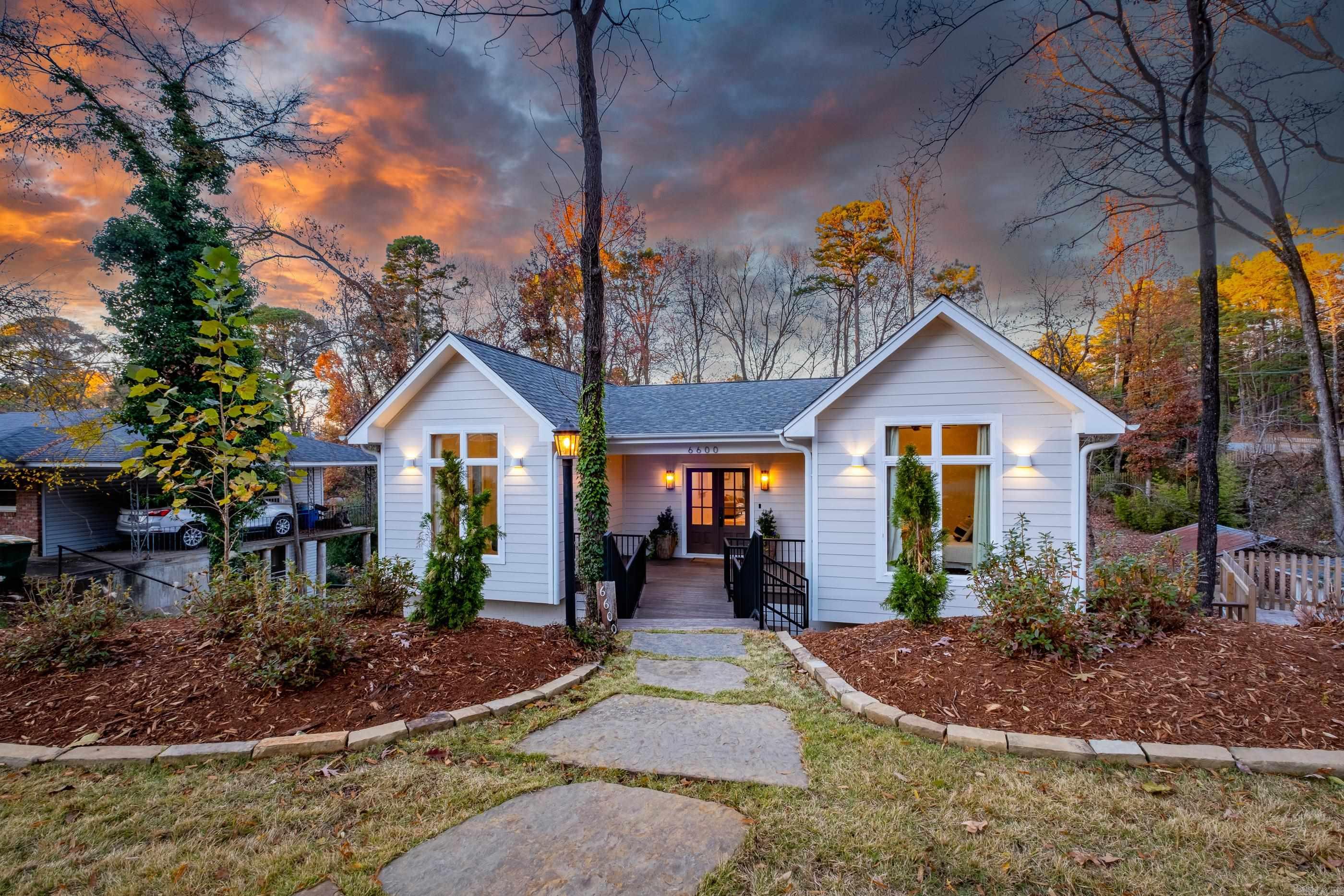 Incredible custom built home/remodel on TWO LOTS w/ a private, park like setting! The home has a wonderful entry that leads into the living, kitchen & dining room. The space has wonderful windows for natural light and brings the outside, in. The living is spacious & has a custom fireplace w/ gas logs & leads out to a large deck. The kitchen has top fo the line stainless steel appliances with commercial oven, large island, custom cabinets quartzite countertops & large butlers pantry. The primary bedroom is located on the main level & has a vaulted ceiling & large walk in closet. The primary bath is resort-esque w/a large soaking tub, custom shower double vanities. A guest bedroom/office w/a vaulted ceiling is also on the main level along w/ a large laundry room. Downstairs offer three bedrooms, two full baths, second laundry/mudroom, office/workout room & a large den w/a wood burning fireplace that leads out to a covered deck. The grounds and landscaping are impeccable and has a creek running through the backyard. Pella windows, surround sound, Hardie-board exterior siding, High efficiency 15 SEER HVACās, high efficiency tankless water heater, solid interior doors, 12x12 shed.