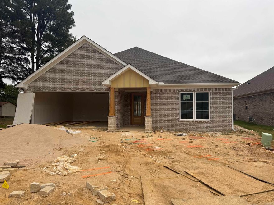 Welcome to your dream home in Benton’s premier subdivision, Spencer Crossing! This stunning brand new construction boasts a spacious three-bedroom, two-bathroom layout designed for modern living. Step into the heart of the home where custom-built, soft-close floor-to-ceiling cabinets adorned with quartz countertops, complemented by a freestanding stove & a convenient pantry for all your culinary needs. Cozy up by the brick gas fireplace in the open living area, perfect for entertaining or relaxing evenings at home. Retreat to the private primary suite featuring a luxurious primary bath complete with double vanities and a large walk-in tile shower, offering a spa-like oasis right at home. The split floor plan ensures privacy with spacious spare bedrooms, providing ample space for family or guests. Step outside onto the covered porch & immerse yourself in the tranquility of the backyard, where you’ll love spending time in the expansive, fully fenced outdoor living space. Whether it’s morning coffee or evening gatherings, this home offers the perfect setting for enjoying the outdoors. Don’t miss out on the opportunity to make this beautiful home yours!