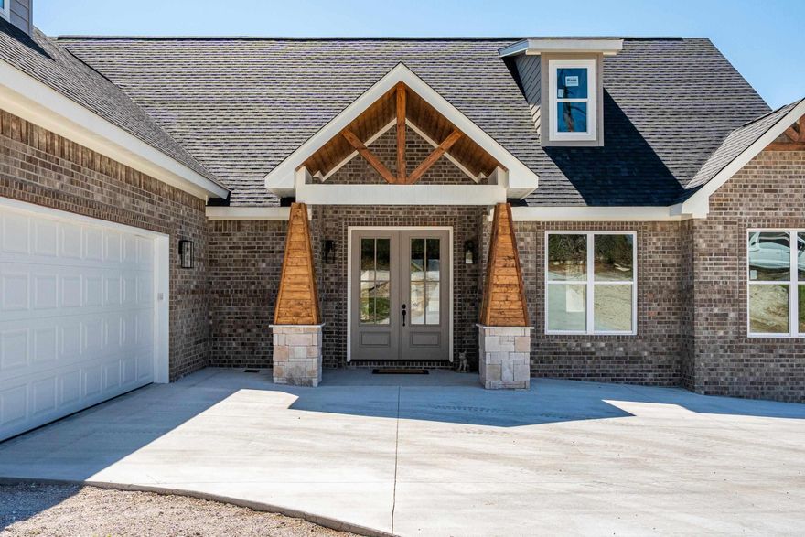 Discover the perfect blend of comfort, elegance, and functionality in this brand-new construction home designed for all lifestyles. Features 3 spacious bedrooms plus an above-garage bonus room with half bath ideal for a home office, playroom, or guest suite. 2 full baths & 2 half baths for convenience and privacy. 2-car garage with dedicated storage rooms and attic storage. Living open concept design with a stunning stone gas-log fireplace as the living room centerpiece. Eat-in kitchen featuring a breakfast island, and direct access to the back deck outdoor living space complete with a second stone fireplace perfect for entertaining year-round. Stainless steel smudge proof GE- Profile appliances including dual fuel stove. Separate dining room for formal gatherings and celebration. Luxurious on suite with walk-in shower, soaker tub, water closet, and double vanities. Expansive walk-in closet with custom-built ins. Custom cabinetry and Taj Mahal quartzite countertops throughout for timeless beauty. A prestige location known for breathtaking sunsets, lake views and lake homes. Easy commute to work, schools, and local amenities.