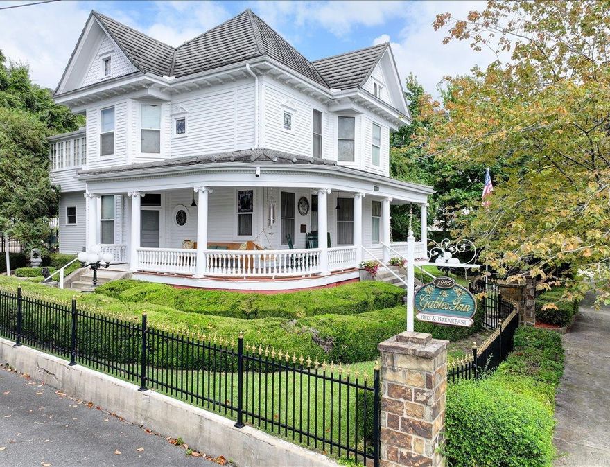 Step into history with The Gables Inn Bed & Breakfast, a beautifully preserved 1905 landmark located in the Quapaw/Prospect Historic District of Hot Springs. For nearly 30 years, this Inn has welcomed guests from around the world, offering an unmatched location just four blocks from Historic Downtown, Bathhouse Row, spas, and Hot Springs National Park.  The property features 5 bedrooms, 5.5 bathrooms, formal living and dining rooms, fitness area, owner’s quarters, wraparound porches, landscaped grounds, gazebo, and a detached 2-car garage. A metal roof with lifetime warranty, tankless hot water heaters, and modern updates combine seamlessly with historic charm. Most furnishings and appliances convey, making this a true turnkey business opportunity.  Whether continuing as a successful bed & breakfast or reimagining as a vacation rental or private estate, this property offers endless potential in one of Arkansas’s top tourist destinations.